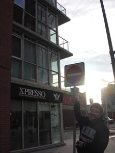 Rob outside pointing out our apartment.